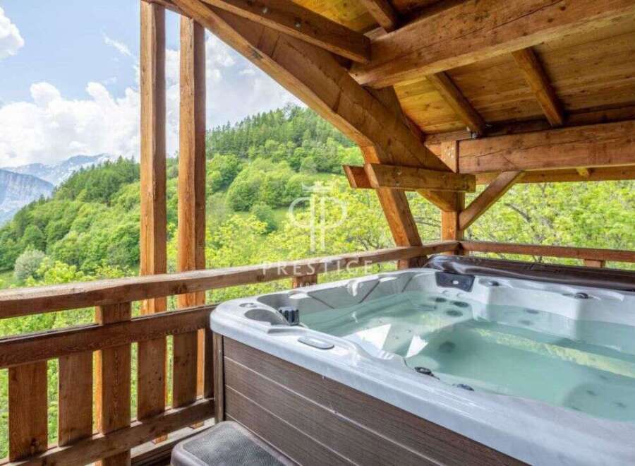 Relax and unwind in this stunning outdoor hot tub, surrounded by breathtaking mountain views.
