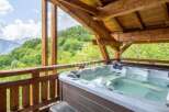 Relax and unwind in this stunning outdoor hot tub, surrounded by breathtaking mountain views.