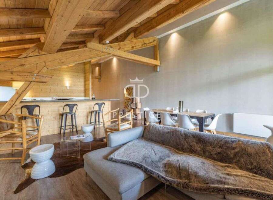 Experience luxury living in this stunning property, featuring a modern design with a touch of rustic charm.