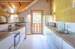 Discover the charm of this stunning kitchen, featuring a modern design with sleek white cabinetry and warm wooden accents.