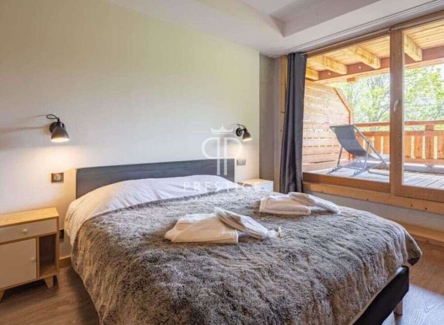 Discover a cozy bedroom with a plush, inviting bed, perfect for relaxation.