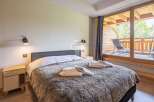Discover a cozy bedroom with a plush, inviting bed, perfect for relaxation.