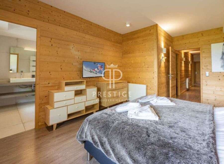 Experience luxury in this stunning property featuring exquisite wooden paneling throughout.