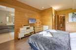 Experience luxury in this stunning property featuring exquisite wooden paneling throughout.