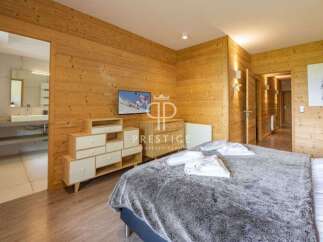 Experience luxury in this stunning property featuring exquisite wooden paneling throughout.
