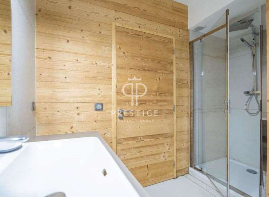 Discover a luxurious bathroom featuring stunning wood paneling that exudes warmth and sophistication.