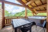 Escape to your mountain retreat! This stunning property boasts a private hot tub and a spacious deck, perfect for relaxation.