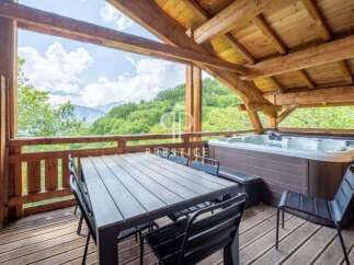 Escape to your mountain retreat! This stunning property boasts a private hot tub and a spacious deck, perfect for relaxation.