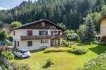 Discover a charming property nestled in a serene, natural setting.