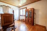 Discover the charm of this property, featuring a warm wooden floor and a classic wooden cabinet.