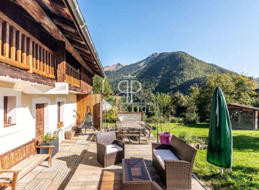 Discover the charm of this stunning property, featuring a beautiful wooden deck perfect for outdoor relaxation.