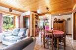 Discover the charm of this cozy property, featuring a warm wooden ceiling and inviting living spaces.