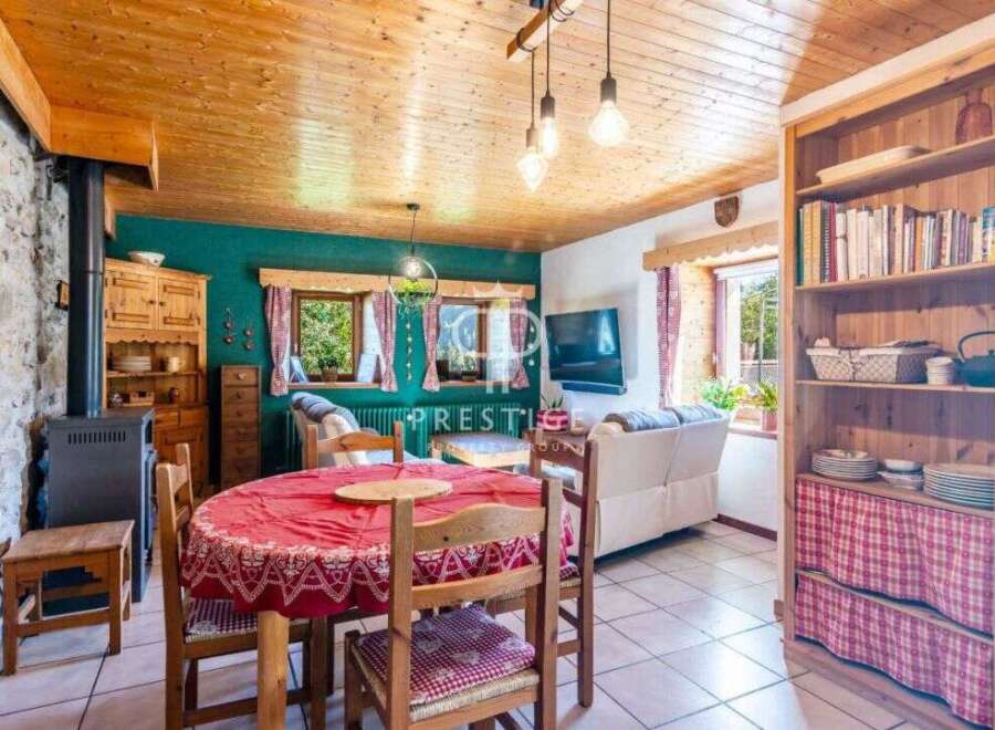 Discover the charm of this cozy property, featuring a warm wooden ceiling and inviting living spaces.
