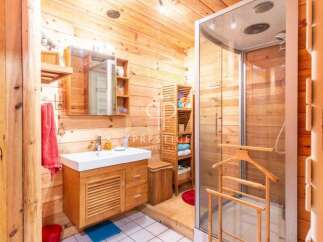 Step into a rustic bathroom retreat, where natural wood paneling creates a warm and inviting atmosphere.