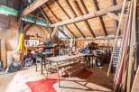 Discover the charm of this unique property! This space boasts a rustic interior with exposed wooden beams and a spacious layout.