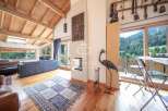 Experience luxury living in this stunning property, featuring a cozy fireplace and a spacious living area.