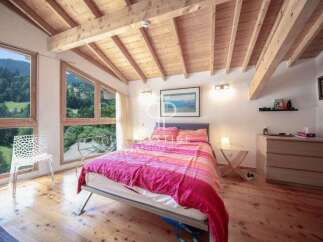 Experience the charm of this cozy bedroom with stunning mountain views.