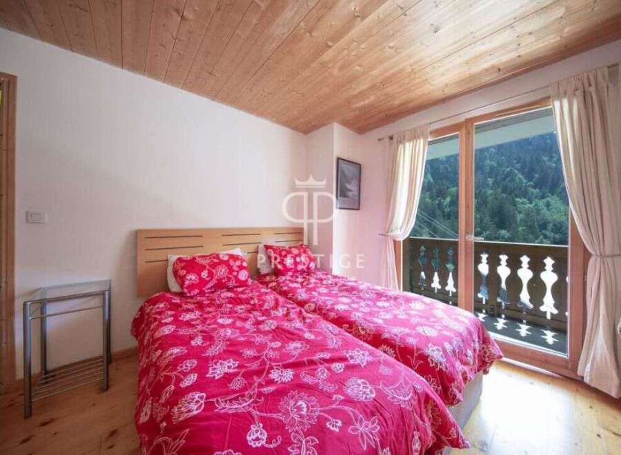 Discover a cozy bedroom with a stunning view.