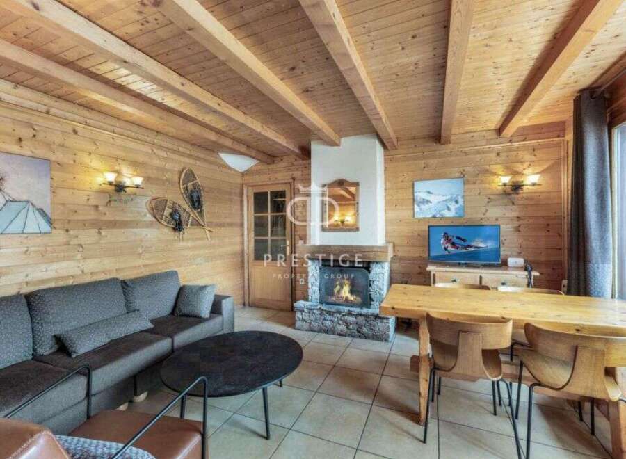 Experience the warmth of this charming chalet, featuring stunning wooden interiors and a cozy fireplace.