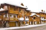 Discover the charm of this stunning wooden chalet, perfect for a winter getaway.