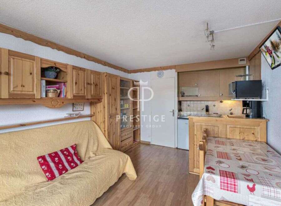 Cozy and charming apartment with wooden accents throughout.