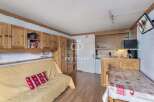 Cozy and charming apartment with wooden accents throughout.