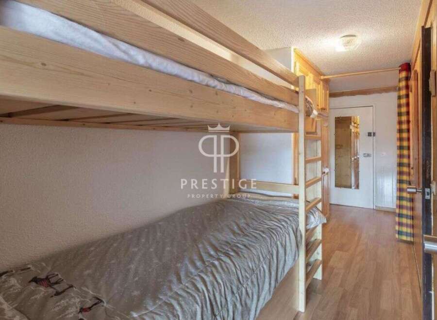 Cozy bunk beds offer a comfortable sleeping arrangement in this charming property.