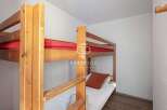 Cozy bunk beds offer a comfortable sleeping arrangement, perfect for families or groups.