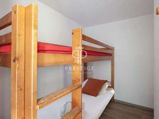 Cozy bunk beds offer a comfortable sleeping arrangement, perfect for families or groups.