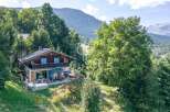 Discover a stunning mountain retreat nestled amidst lush greenery.