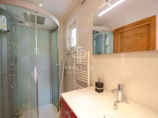 Discover a luxurious bathroom with a modern shower and elegant design.