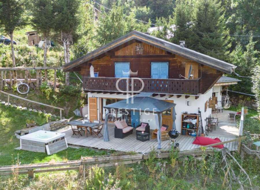 Discover a stunning chalet nestled in a serene, natural setting.