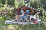 Discover a stunning chalet nestled in a serene, natural setting.