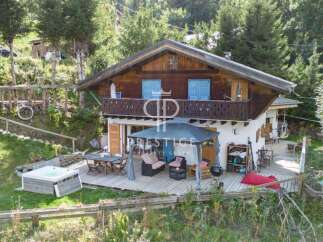 Discover a stunning chalet nestled in a serene, natural setting.