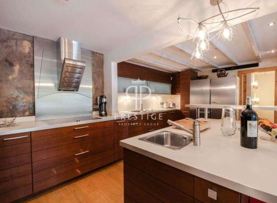 Discover luxury living in this stunning kitchen! Featuring sleek stainless steel appliances, rich wooden cabinetry, and a modern design, this space is perfect for both cooking and entertaining.