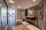 Discover luxury living at its finest! This stunning property boasts a modern bathroom with a sleek glass shower and elegant floating vanity.