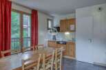 Discover a charming property with a cozy dining area, perfect for gatherings.
