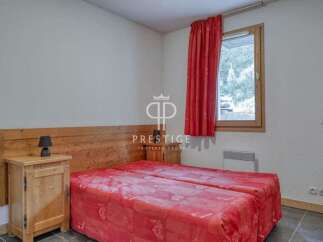Discover a cozy bedroom with a comfortable bed, perfect for a relaxing stay.