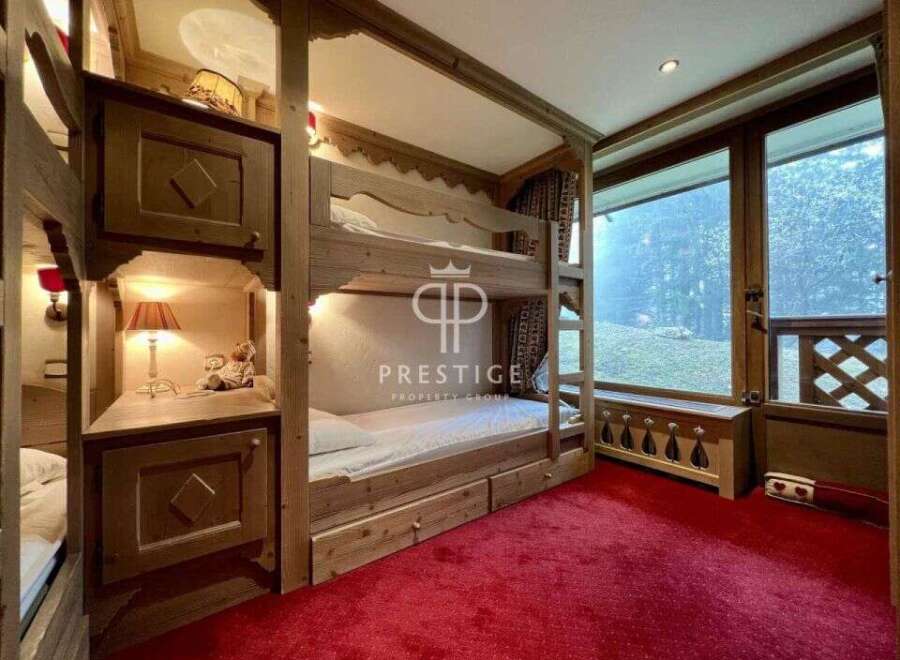Discover a cozy bedroom with charming bunk beds, perfect for a family getaway.