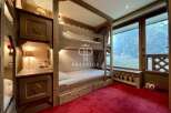 Discover a cozy bedroom with charming bunk beds, perfect for a family getaway.