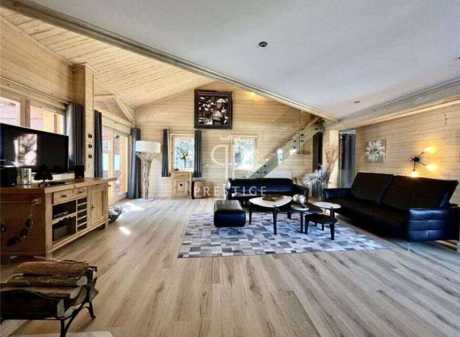 Experience luxury living in this stunning property, featuring a spacious and inviting living room.