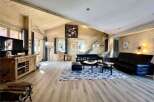 Experience luxury living in this stunning property, featuring a spacious and inviting living room.