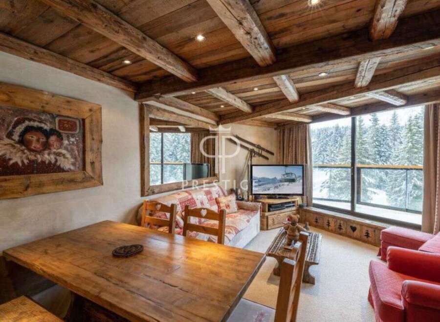 Experience the charm of this cozy chalet, featuring a rustic wooden interior and stunning views.