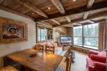 Experience the charm of this cozy chalet, featuring a rustic wooden interior and stunning views.