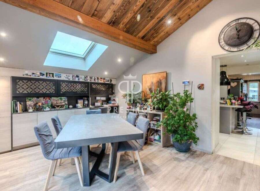Discover the charm of this stunning property, featuring a modern dining area with a stylish table and chairs.