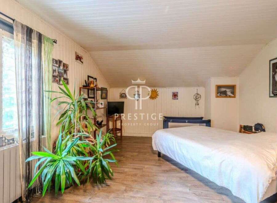 Discover a charming attic bedroom with a cozy atmosphere.