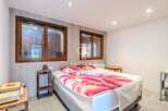 Discover a cozy bedroom with natural light streaming through the windows.