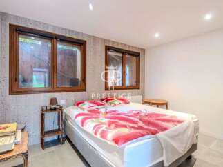 Discover a cozy bedroom with natural light streaming through the windows.