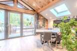 Experience the charm of this stunning property, featuring a bright and airy interior with a unique wooden ceiling.