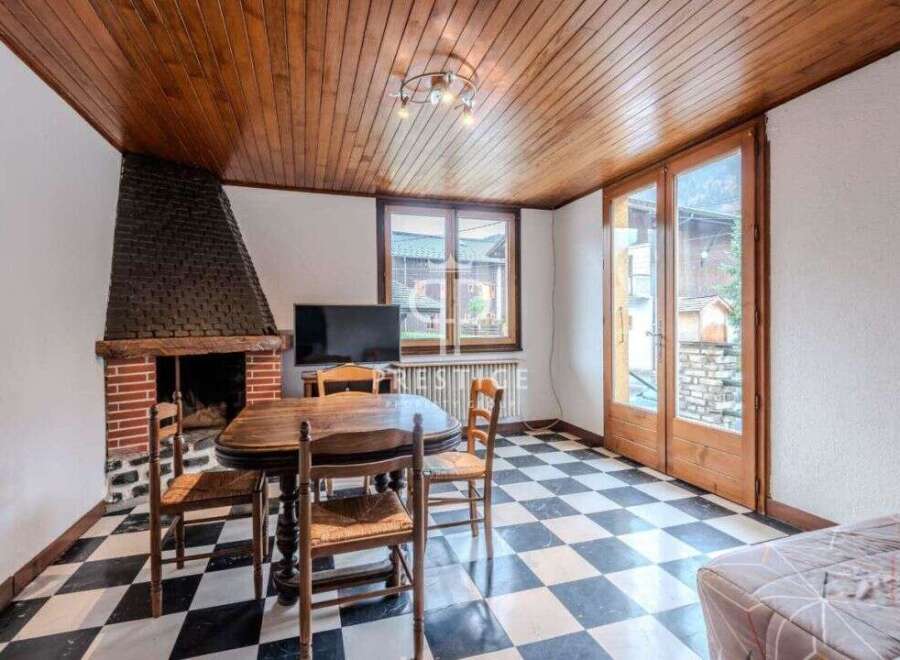 Discover a charming living space featuring a cozy fireplace, perfect for those chilly evenings.